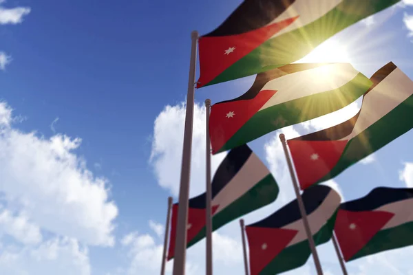 Bandiere giordane sventolano nel vento contro un cielo blu. Rendering 3D — Foto Stock