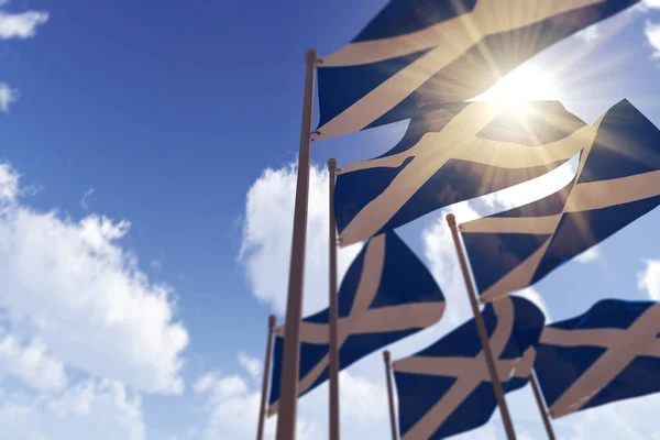 Skotské vlajky vlnící se ve větru proti modré obloze. 3D vykreslování — Stock fotografie
