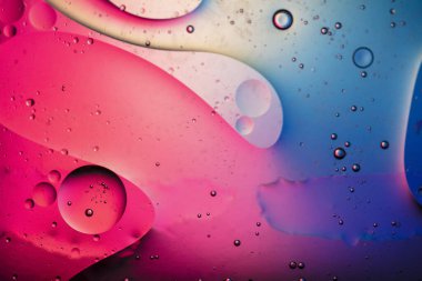 Kabarcıklı soyut renkli makro yağ ve su arkaplanı.