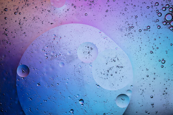 Abstract colourful creative macro oil and water background with bubbles.