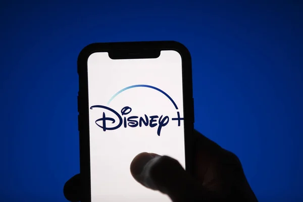 LONDON, UK - April 17 2020: Disney plus streaming service logo on a smartphone — Stock Photo, Image