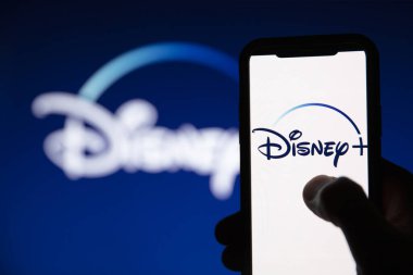 LONDON, UK - April 17 2020: Disney plus streaming service logo on a smartphone clipart