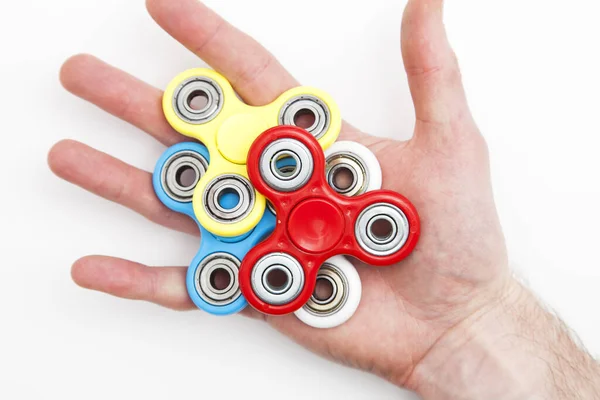 Male hand holding popular fidget spinner toy — Stock Photo, Image