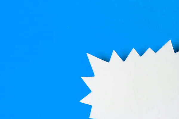 Blank promotional starburst sales banner on a bright blue background — Stock Photo, Image