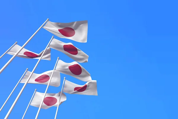 Banderas de Japón ondeando en el viento contra un cielo azul. Renderizado 3D — Foto de Stock