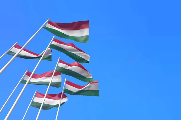 Unkari liput heiluttavat tuulessa sinistä taivasta vasten. 3D-renderointi — kuvapankkivalokuva