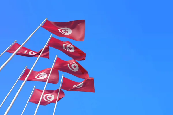 Tunesien-Fahnen wehen im Wind vor blauem Himmel. 3D-Rendering — Stockfoto