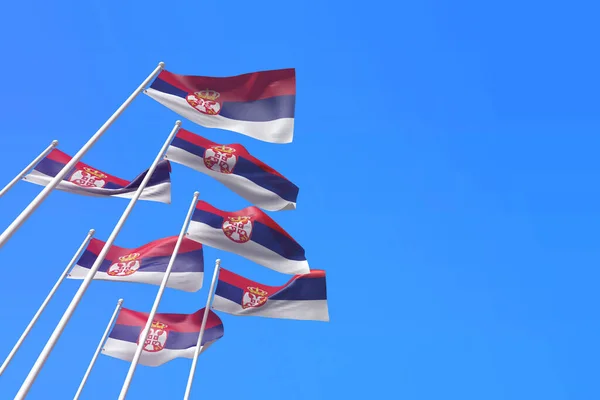 Srbské vlajky vlnící se ve větru proti modré obloze. 3D vykreslování — Stock fotografie