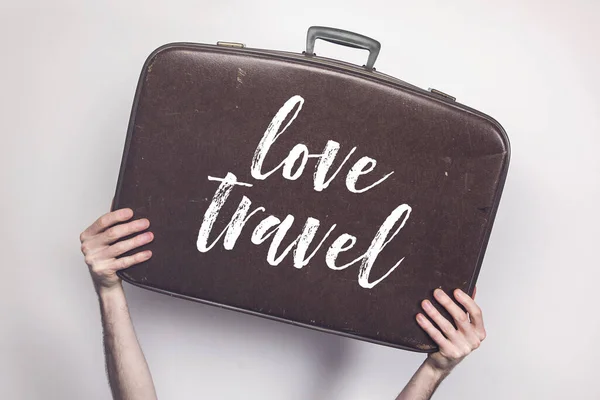 Love travel message on a vintage travel suitcase — Stock Photo, Image