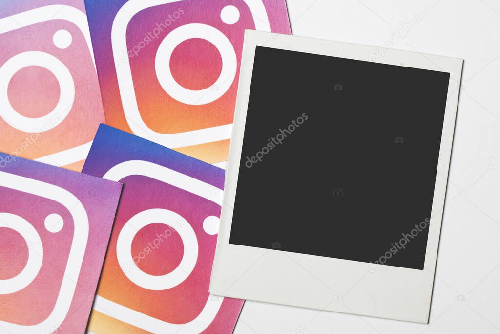 OXFORD, UK - DEC 7 2016: Blank polaroid frame with Instagram social media logo