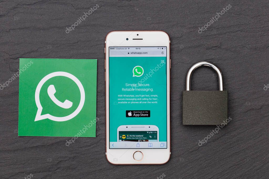 LONDON, UK - MARCH 2017: WhatsApp messaging app on a smartphone with a padlock.