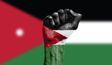 Sıkışmış bir yumruğa Jordan bayrağı boyanmış. Kuvvet, Protesto konsepti