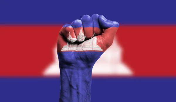 Kambodscha-Flagge mit geballter Faust. Stärke, Protestkonzept — Stockfoto