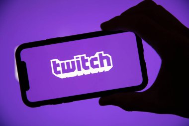 LONDON, UK - April 30 2020: Twitch game live streaming logo on a smartphone clipart
