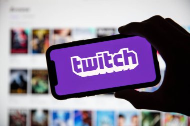 LONDON, UK - April 30 2020: Twitch game live streaming logo on a smartphone clipart