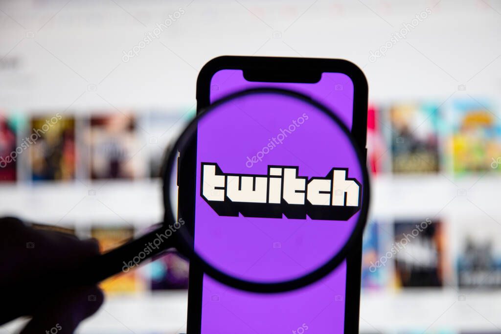LONDON, UK - April 30 2020: Twitch live gaming logo under a magnifying glass