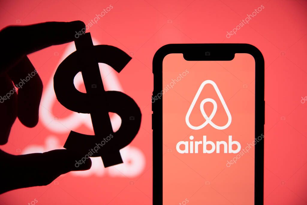 LONDON, UK - May 15 2020: Airbnb home vacation rental logo with a dollar symbol