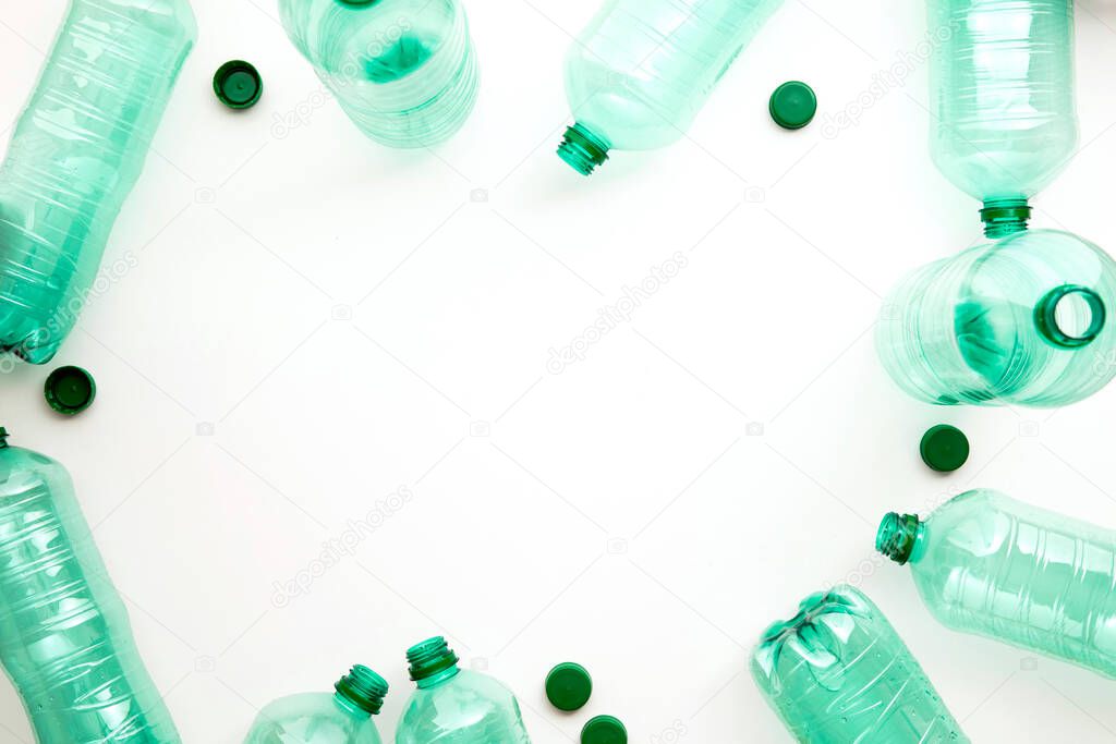 Empty green plastic waste water bottles ready to be recycled.