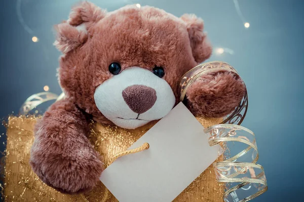 Christmas card with Teddy Bear. With holiday decoration and presents