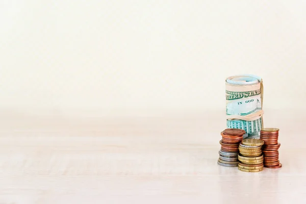 US dollar bank notes and Stacks of coins. Copy space