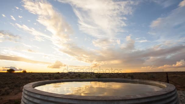 Time lapse sunset over man-made farm dam — Stock Video