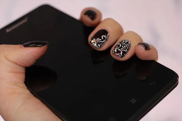 Nails in tone smartphone — Stock Photo, Image