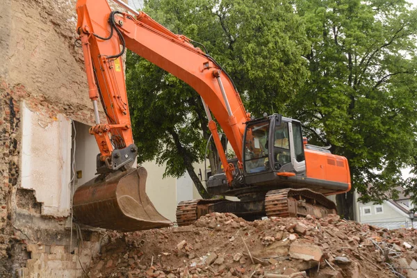 Chain excavator at demolition site