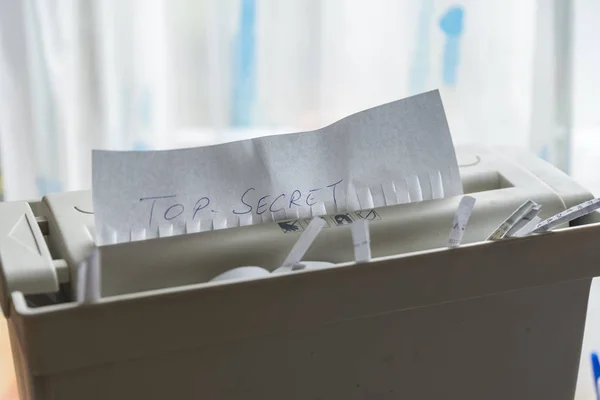 Document shredder with top secret document — Stock Photo, Image