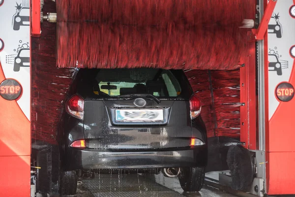 Car is washed clean in car wash - car cleaning