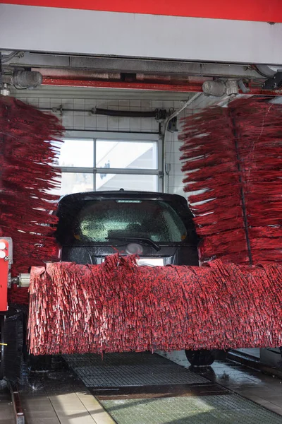 Car is cleaned of dirt in car wash - car cleaning