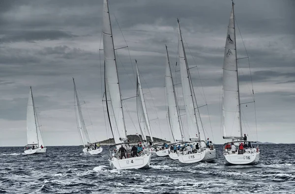 Croatia, Adriatic Sea, 19 September 2019: The race of sailboats, a regatta, rainy weather, Intense competition, island on background — Stock Photo, Image