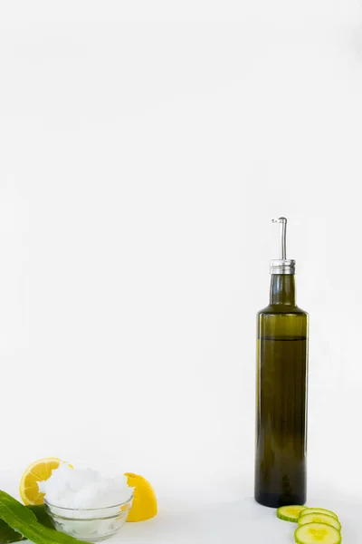 Vertical of olive oil aloe lemon cucumber and coconut oil healthy natural beauty — Stock Photo, Image