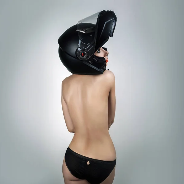 Naked girl in a motorcycle helmet — Stock Photo, Image