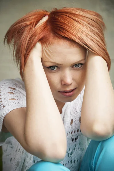 Pensive redhaired woman Royalty Free Stock Images