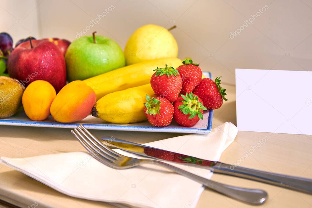 complimentary fruit basket in the hotel room,with free space for the welcome message