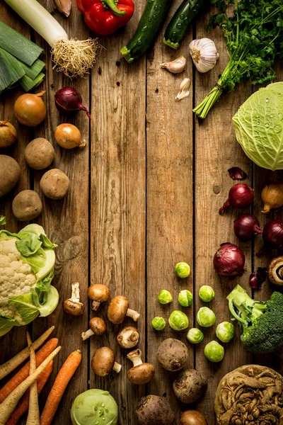 Autumn (fall) vegetables on vintage wooden background