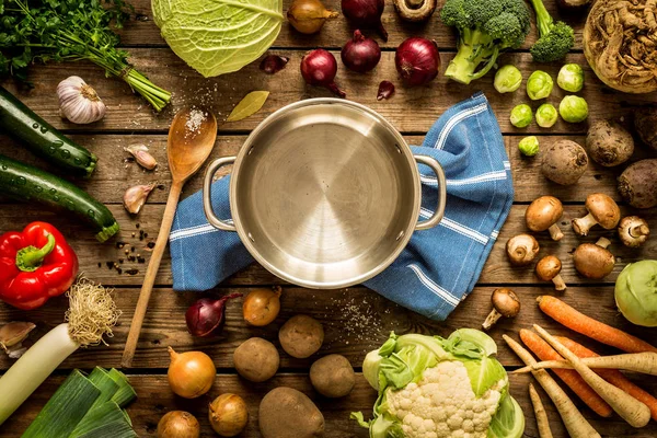 Cooking - empty pot with autumn (fall) vegetables around — Stock Photo, Image