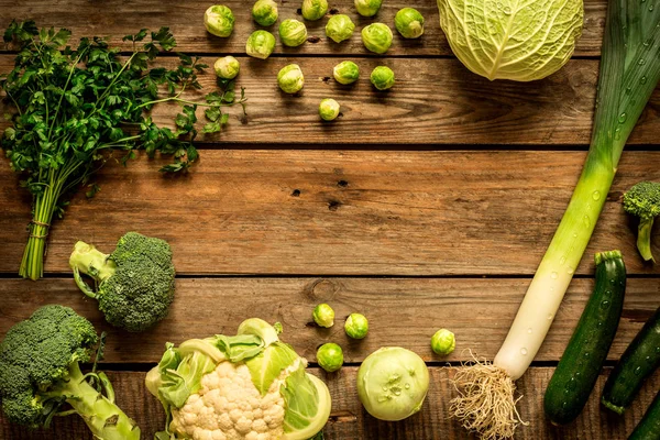 Green vegetables on vintage rustic wooden background — Stock Photo, Image