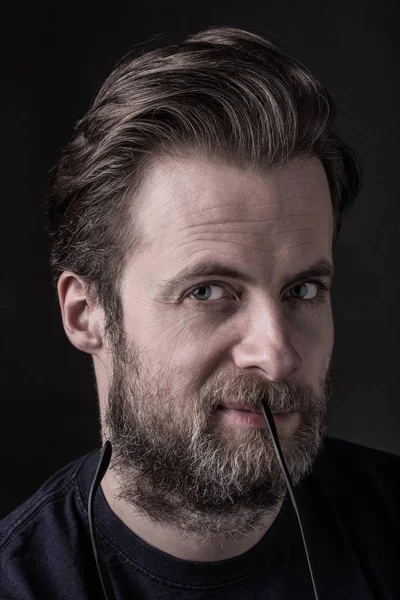 Dark moody portrait (face) of caucasian bearded man — Stock Photo, Image