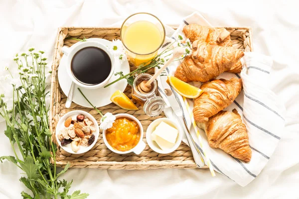 Continental breakfast on white bed sheets - flat lay — Stock Image Continental breakfast on white bed sheets - flat lay Stock Image