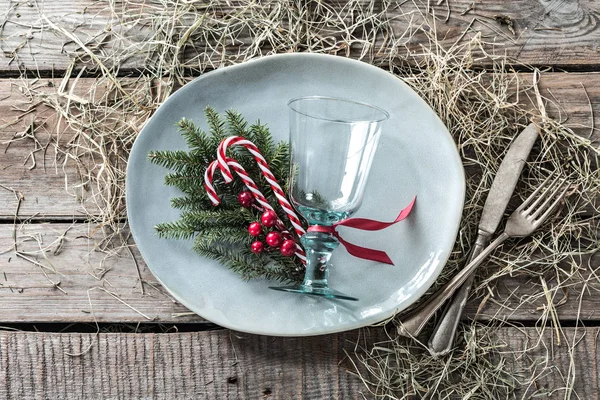 Rustic christmas table setting design - plate on wooden table