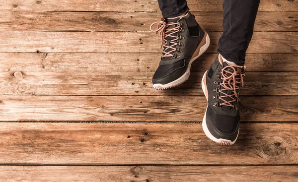 Footwear - dark blue trekking shoes (boots) on legs — Stock Photo, Image