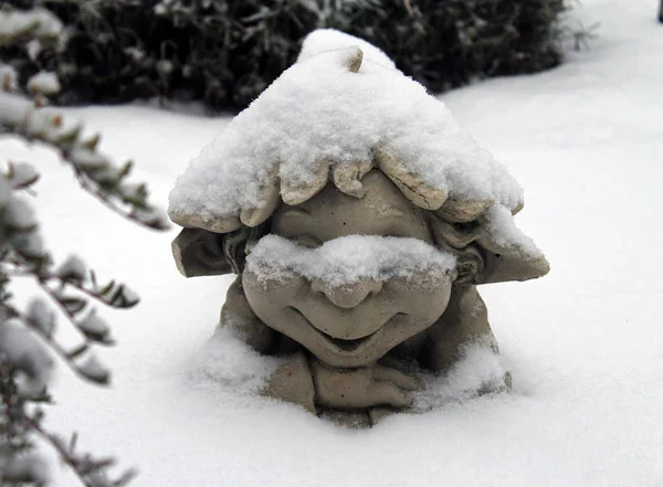 Funny garden dwarf in the snow — Stock Photo, Image