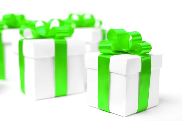 White gift box with green ribbon bow — Stock Photo, Image