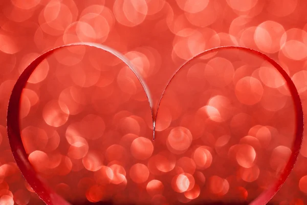 Red ribbon hearts on glitters — Stock Photo, Image