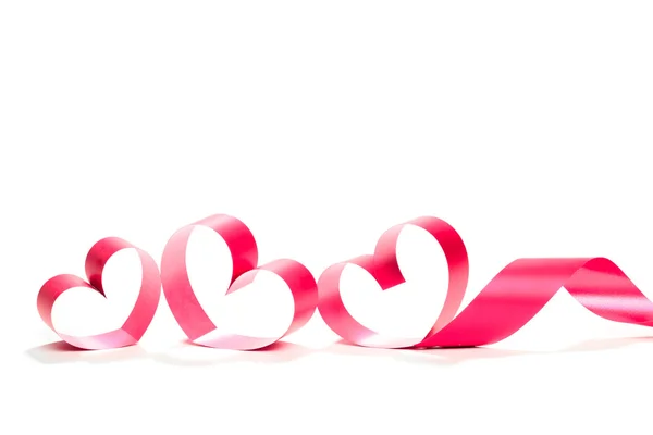 Ribbons shaped as hearts on white — Stock Photo, Image