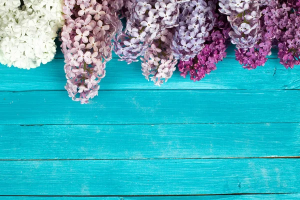 The beautiful lilac on a wooden background — Stock Photo, Image