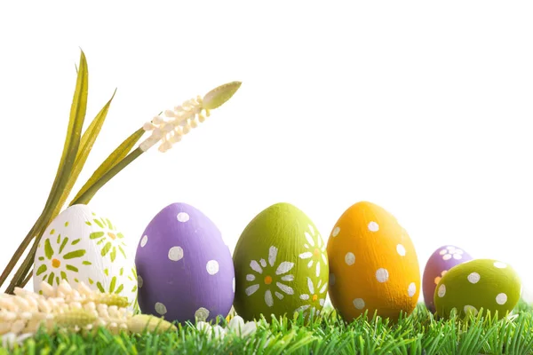 Bunch of easter eggs in pastel colors on grass — Stock Photo, Image