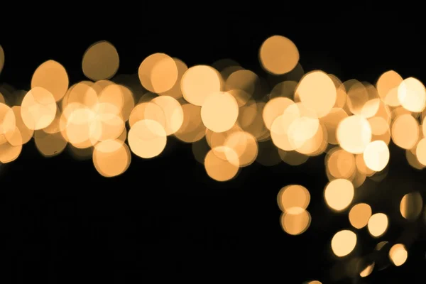 Abstraktní gold sparkle na tmavém pozadí — Stock fotografie