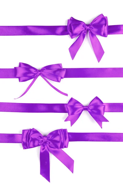 Набор фиолетовых ленточных атласных бантов — стоковое фото